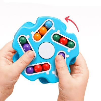 China Plastic Double Sides Colorful Jigsaw Puzzle Balls Finger Spinner Plastic Toy For Kids And Adult for sale