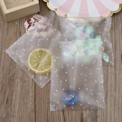 China New design recyclable high quality white dots pe gift transparent frosted plastic bag for party for sale