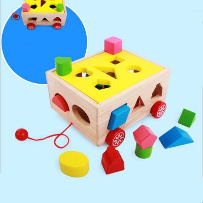 China Multifunctional Matching Block Pulling Toy Creative Design Multifunctional Drag Car 15 Holes Shapes Wooden Intelligence Box Moving Pull Along Car for sale