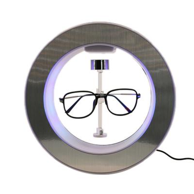 China OEM Magnetic Levitation Sunglasses Modern Floating Rotating Eyeglasses Stand Up Display for sale