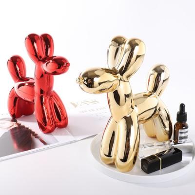 China Northern European Style Home Decoration Animal Shaped Ceramic Golden Balloon Dog Saving Pot Piggy Bank for sale