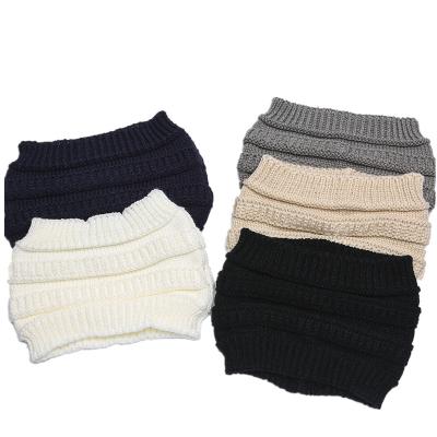 China COMMON winter knit hat cable knit hats with tail hole solid color women knit beanie for sale