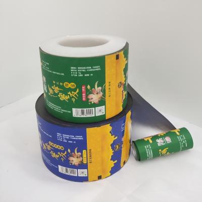 China Customized Design Moisture Proof Printing Automatic Honey Package Aluminum Foil Film Roll Plastic Packaging Food Wrapping Film for sale