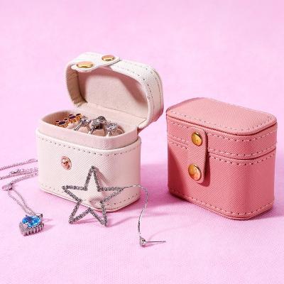 China Mini Jewelry Package Dynamic PU Jewelry Box Travel Jewelry Organizer Storage Rings Earrings Packaging Small Case Mini Women Jewelry Box for sale