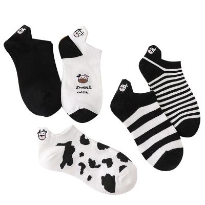 China saucony women's sock boat socks high quality dynamic Anti-fault black and white cow spots tube socks for sale