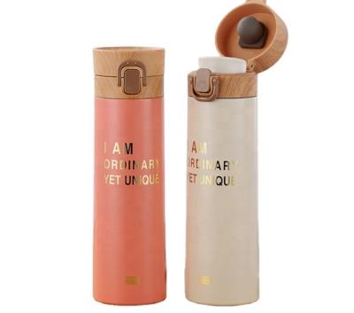 China 500ml PORTABLE Double Walled Stainless Steel Custom Logo Vacuum Flask Water Bottle with Wood Grain for sale