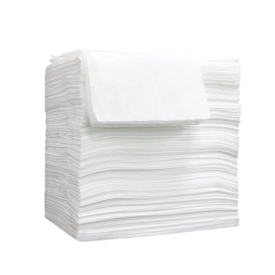 China Convenient Surgical Drapes With Hole White Nonwoven Sheets Disposable Nonwoven Drape For Spa for sale