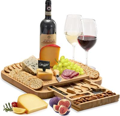 China Low Price Sustainable Lightweight Bamboo Wooden Appetizer Plates With Wine Glass Cutout Holder For Cocktail Party for sale