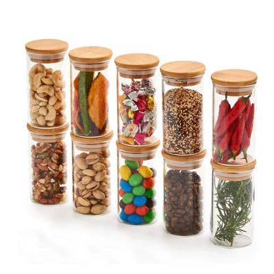 China Non Puddle Frosted Borosilicate Packaging Bamboo Bamboo Lid Storage Glass Jar With Wooden Cork Lid for sale