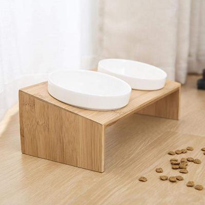 China Eco-friendly Sustainable Green Pet Food Bowl Stand Dog Bamboo Dining Table for sale