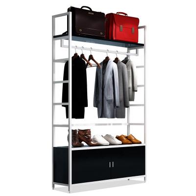 China Single Sided Wooden Display Stand Clothes Display Rack With Bottom Cabinet for sale