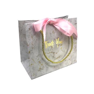 China Recyclable Custom Printing Ribbon Closure Luxury Marble Paper Bag Packaging for sale