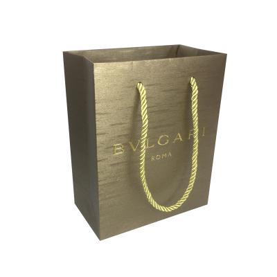 China Custom High End Metallic Gold Foil Recyclable And Embossing Logo Jewelry Paper Gift Bag for sale