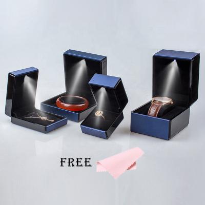 China PU LED Light Lamp Jewelry Display Gift Box Packaging Leather Ring Pendant Bracelet Watch Jewelery Case Custom Jewellry for Engagement for sale