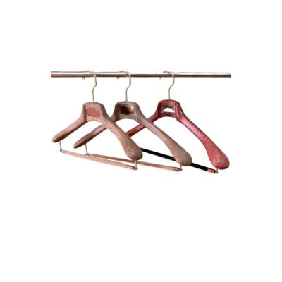 China Retro Women and Women's Clothes Shop Plastic Wood Like Hanger Log Color Plastic Suit Hanger for sale