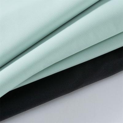 China OEM 220GSM 23 Stain Resistant Four-Way-Stretch Fabric 77 Nylon Spandex 70D Nylon Stretch Fabric For Shaperwear Sportswear for sale