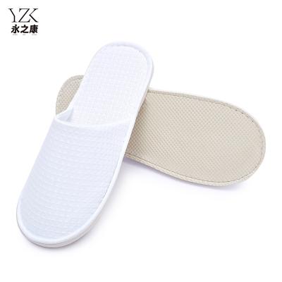 China Exquisite Disposable Hotel Amenities Hotel Supplies Closed Toe Disposable Sleepers Waffle Custom Slippers With Logo Hotel Slippers for sale