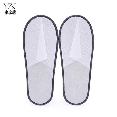 China Exquisite Disposable Hotel Amenities Cheap Non-Slip Unisex Disposable Nonwoven Slippers hotel None-woven Slippers for Hotel Home Guest Massage Use for sale