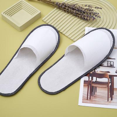 China Exquisite Disposable Hotel Amenities Wholesale cheap custom logo package disposable white non woven hotel slippers for sale