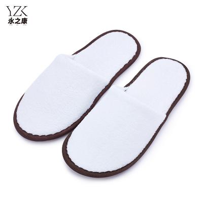 China Exquisite Disposable Hotel Amenities Hotel Slipper Closed Toe Luxury White Coral Fleece EVA Sole Spa 5 Star Hotel Slippers with customized Logo for sale