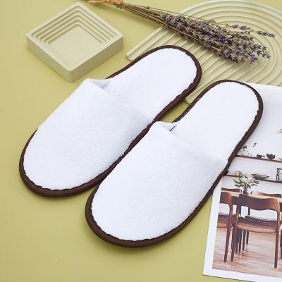 China Exquisite Disposable Hotel Amenities White colored custom logo coral fleece washable indoor slippers hotel disposable slippers luxury for sale