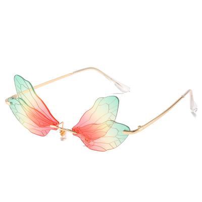 China Fashion Sunglasses Dragonfly Sunglasses For Women Rimless Butterfly Shaped Glass Personality Party Eyewear Italian Design for sale