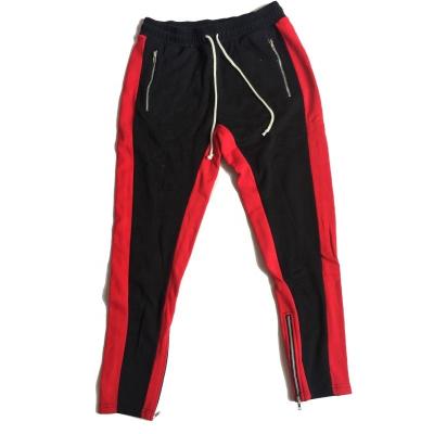 China Anti-pilling mans contrast color large insert panel zipper pockets zipper leg opening track pants for sale