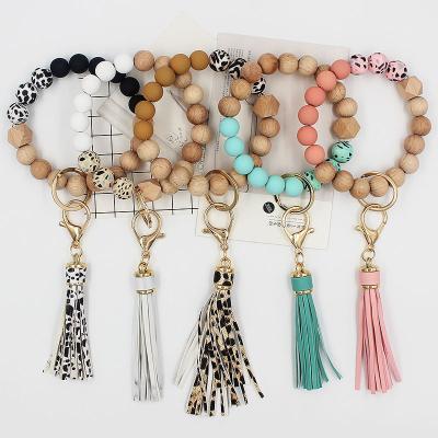 China Best Selling Easy Polymer Clay Wood Grain Beads Key Chain Bracelet With Fringe For Gift for sale