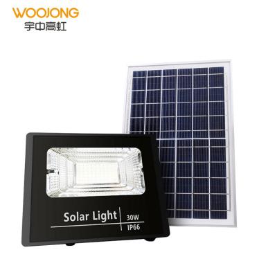 China Outdoor Outdoor Energy Saving IP65 Solar Floodlight With Solar Panel 30W/40W/70W/100W Floodlight With Sensor for sale