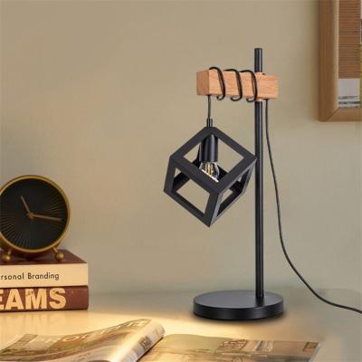 China Beautiful Hotel Hollow Black Luxury Modern Home Decorative Lampshade Desk Lamp Bedside Table Lamp for sale