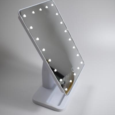 China Lighted Led Cosmetic Makeup Mirror With 22 Led Bulbs And 10x Magnifying Small Mirror for sale