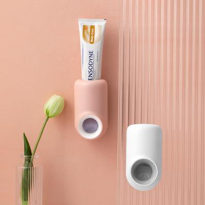 China Wall Mounted Sticker Viable Wall Mounted Bathroom Plastic Contrast Color Manufacturer Automatic Squeeze Toothpaste Storage Rack for sale