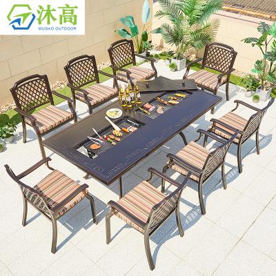 China Eco-Friendly Patio BBQ Dining Table 8 Chairs Gas Fire Table Set Cast Aluminum Outdoor Furniture For Garden for sale