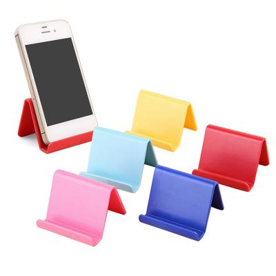 China 2021 New Universal PORTABLE Smart Phone Holder Portable Candy Colors Fixed Laptop Stand Holder For Random Phone Accessories for sale