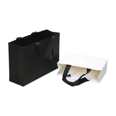 China Custom Small Paper Shopping Bags Customized Black Wedding Handmade Jewelry Gift Bag With Your Own Logo for sale