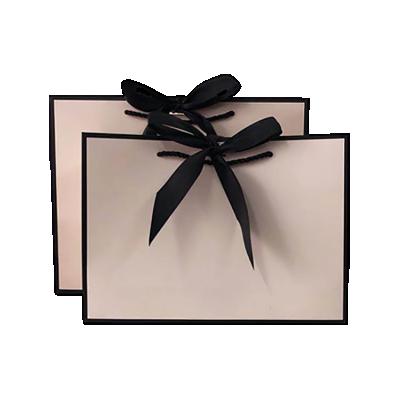 China Handmade Custom Packaging Supplies Kraft Paper Wine Bag Black Holographic Window Envelope Birthday Shopping Paper Bag For Kids for sale