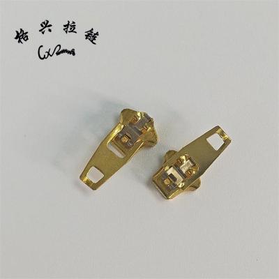 China Non Magnetic Custom No. 4 YG Brass Non Magnetic Spring Lock Zipper Slider For Pants for sale