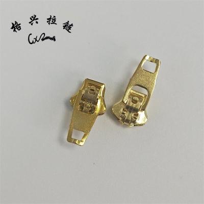 China Other High Quality Custom No 4 YG Spring Lock Pull Iron Zipper Slider For Pants Jeans for sale