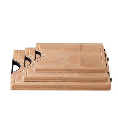 China Kitchen Disposable High Quality Wooden Cutting Plates Bamboo Cutting Board With Handle for sale