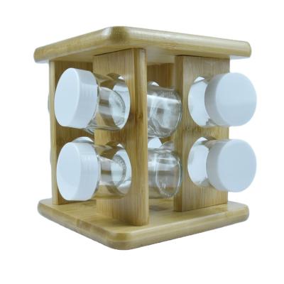 China Sustainable Bamboo Spice Container Buffet Salt And Pepper Wooden Revolving Spice Rack for sale