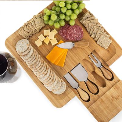 China Sustainable Wooden Board Charcuterie Tray Bamboo Cheese Dish Cheese Board Set and Knife Set with Hidden Slide Drawer for sale