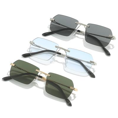 China Comfortable New Trendy Small Size Rectangle Frameless Sun Glasses Hot Sale Women Men Rimless Ocean Lens Metal Sunglasses for sale