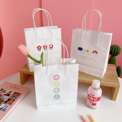 China Recyclable Simple Korean Style Paper Gift Dropshipping Cartoon Printing White Tote Bag Shopping Clothes Shoes Store for sale