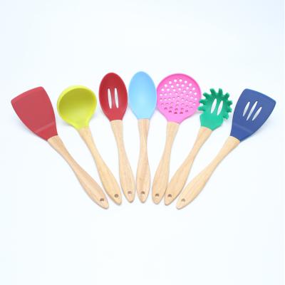 China Viable Colorful Wooden Handle 7Pcs Silicone Kitchen Cookware Set for sale