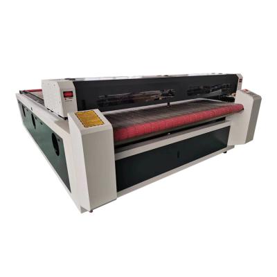 China Engraving and cutting roll to roll CNC laser cutting fabrics machine 1812 1610 1830 with vacuum table for sale