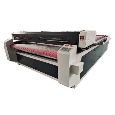 China Engraving and cutting 100w/150w /170w large area apparel/garment/garment fabric laser cutting machine with industrial fabric cutting table for sale