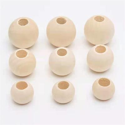 China Different Sizes Crystal Wholesale Natural Round Wooden Bead Beads DIY Big Hole Loose Wooden Beads for sale