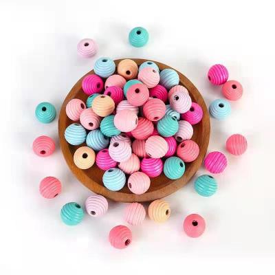 China Various Wood Specifications and Colors of Loose Wood Thread Beads Threaded Wood Bead Crafts for sale