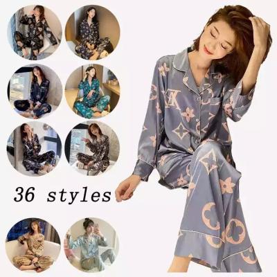 China New ice silk QUICK DRY women's long sleeve pajamas plus size satin home designer silk pajamas loose pajamas for sale