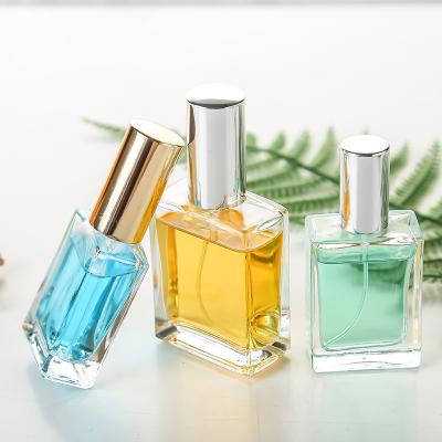 China Personal Care Customized Empty Flat Square Luxury Glass Perfume Bottle With Sprayer 50ml 100ml for sale